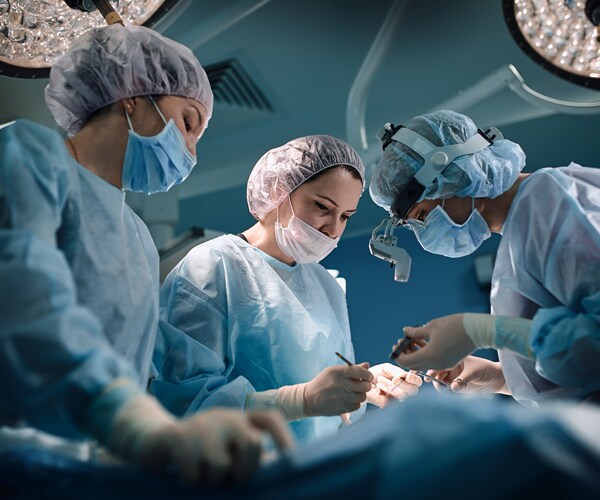 a medical team working on a patient in the operating room