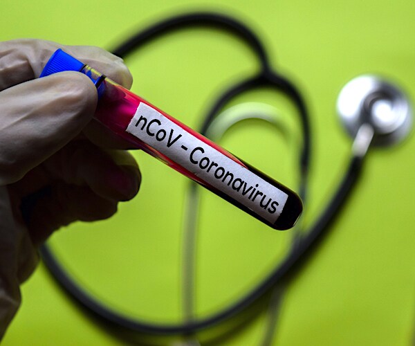 a vile of blood is marked coronavirus