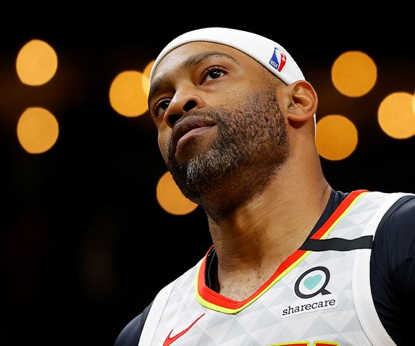 Vince Carter looks on