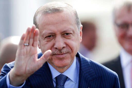 The Latest: Fighters Stop Protesters outside Syria Town