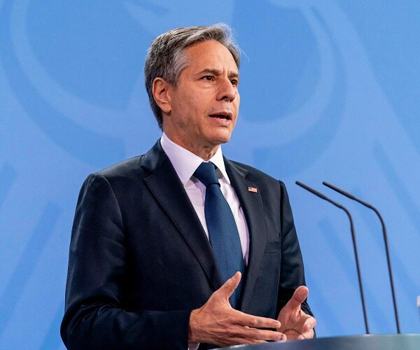 antony blinken speaks into mic