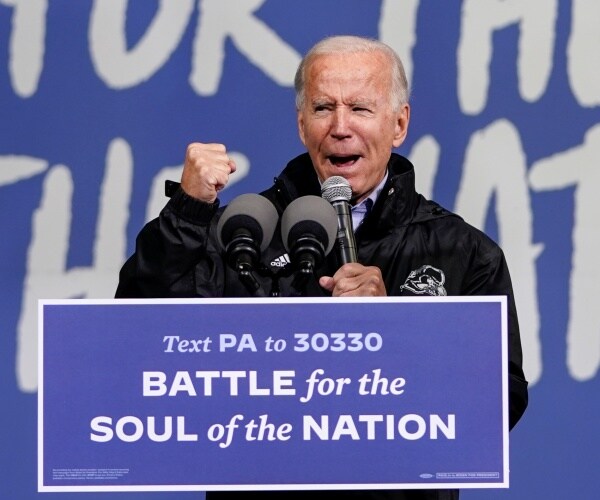 joe biden speaks from behind podium