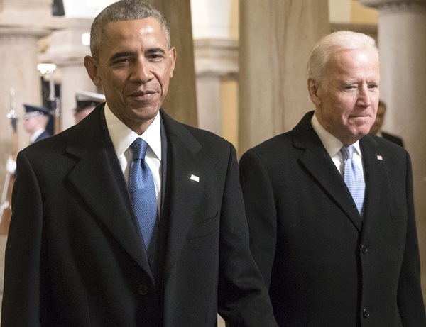 barack obama and joe biden smile smugly