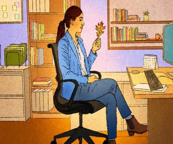 illustration of woman at desk at work in office holding a leaf from outside