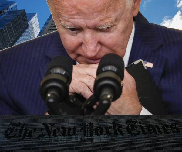 photo of president biden looking down at his podium with image of the new york times building below him