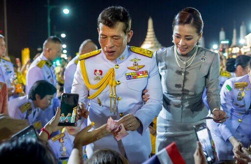Thai King and Queen Take to Street to Meet Adoring Royalists