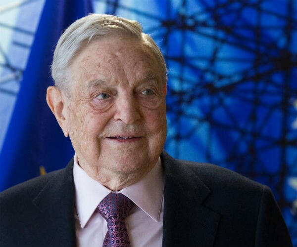 George Soros arrives for a meeting in brussels