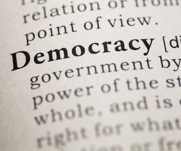 dictionary page with democracy highlighted