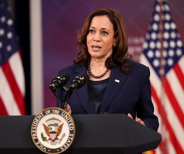kamala harris speaks into mic