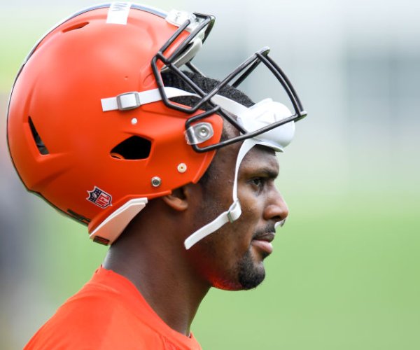 deshaun watson looks on at a cleveland browns practice 