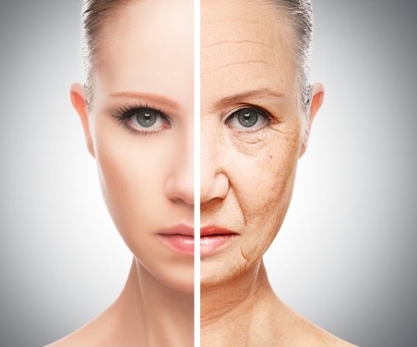 a woman's face, left half young skin, right half aging skin
