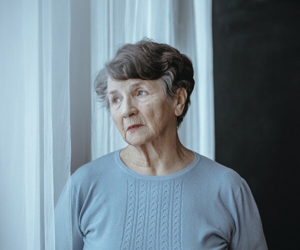woman with Alzheimer's looking confused