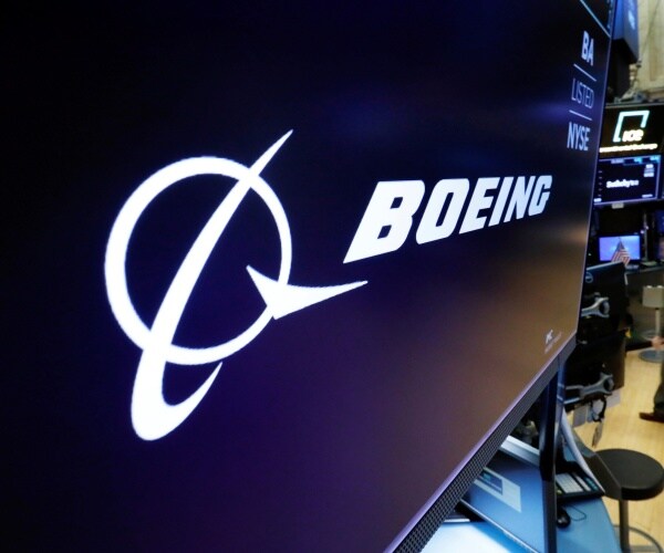 boeing logo is shown on a screen at a trading post