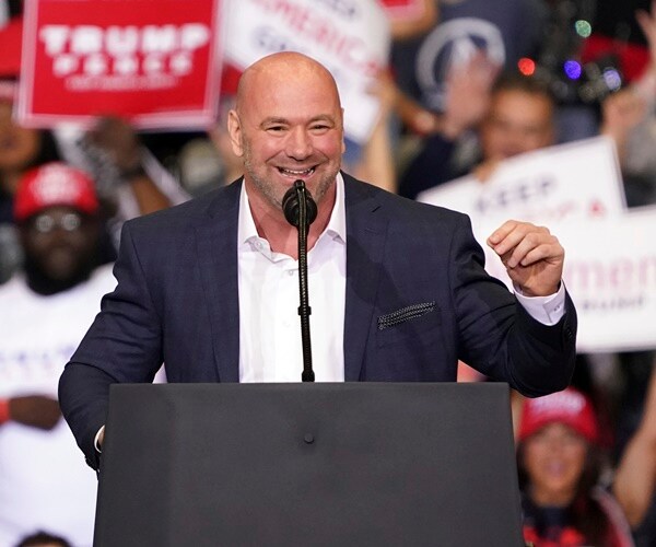 dana white speaks at the podium at a trump rally in 2020