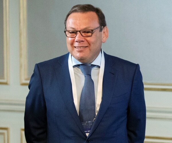 Mikhail Fridman attends a conference.