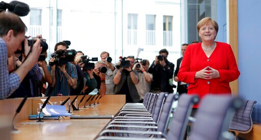 The Latest: Merkel: Britain Will "find Its Way" on Brexit