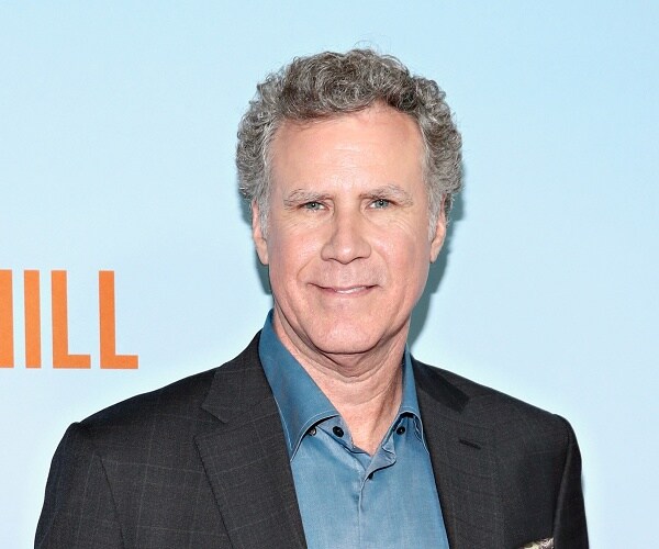 will ferrell stands on red carpet