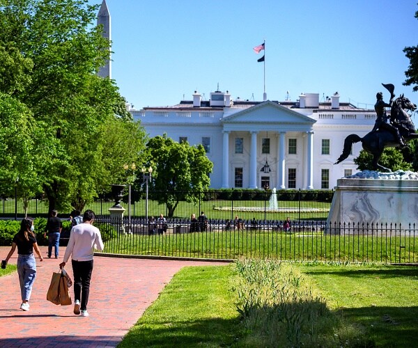 people walk through lafayette square