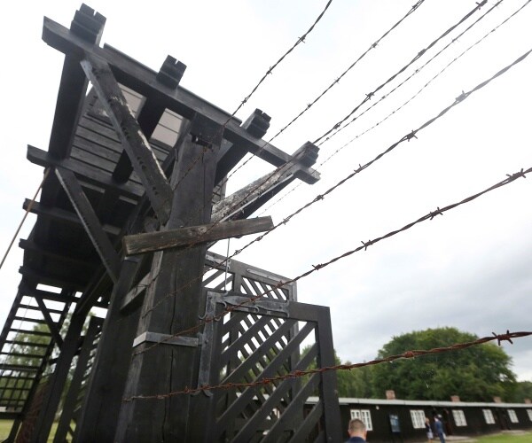 The wooden main gate leads into the former Nazi German Stutthof.