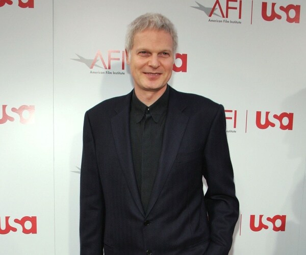 bing in a suit and black dress shirt