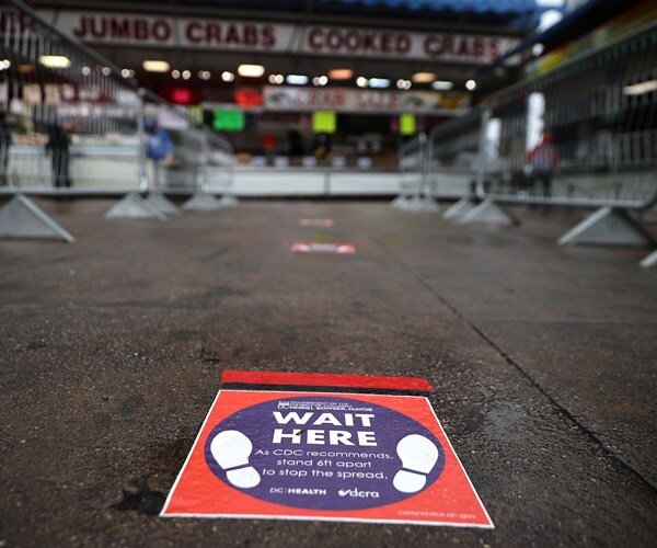 floor decals remind shoppers to keep a distance from each other