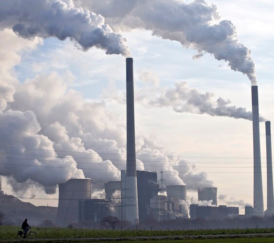 smoke stacks send plumes of smoke into the sky from coal plants