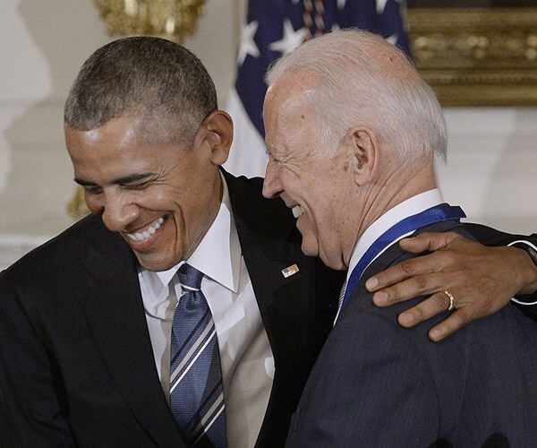 president obama hugs and laughs with vice president joe biden