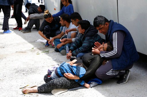 The Latest: Buses with Migrants Heading toward Bosnia Camp