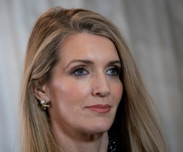 closeup of loeffler wearing pearl earrings