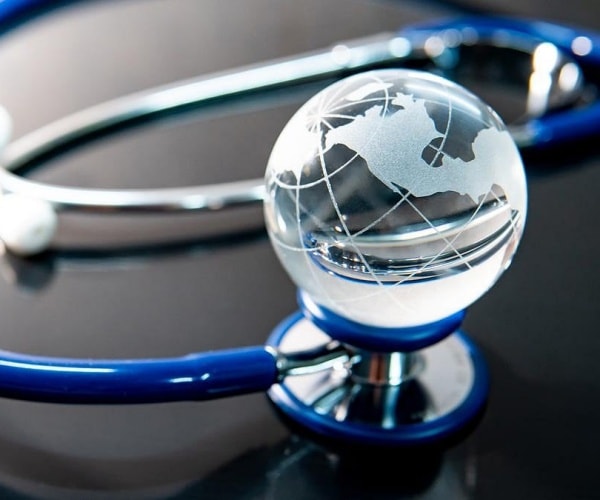 stethoscope and glass globe