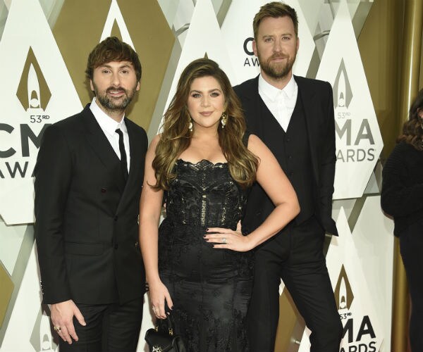 Dave Haywood, Hillary Scott, and Charles Kelley of Lady Antebellum at the CMA Awards in Nashville in 2019