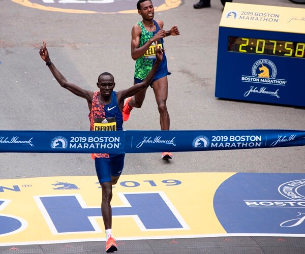 the winner of the boston marathon crosses the finish line