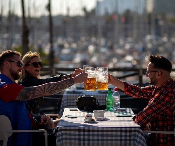 people toast on bar terrace