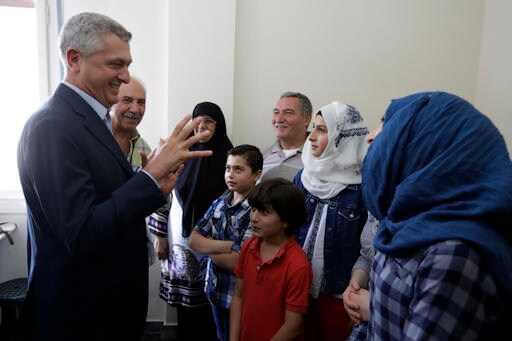 The Latest: Greece Searches for 60 People on Smuggling Boat