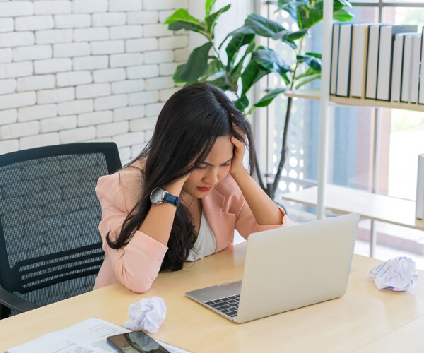 a woman suffering from a headache