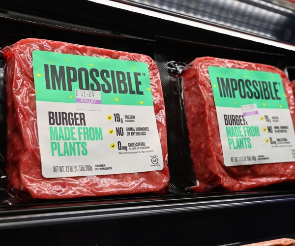 impossible foods' plant-based meat sits on a grocery store shelf