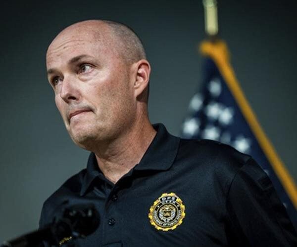 spencer cox looks on