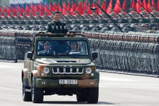 Xi Asserts Authority over Hong Kong in PLA Troop Inspection