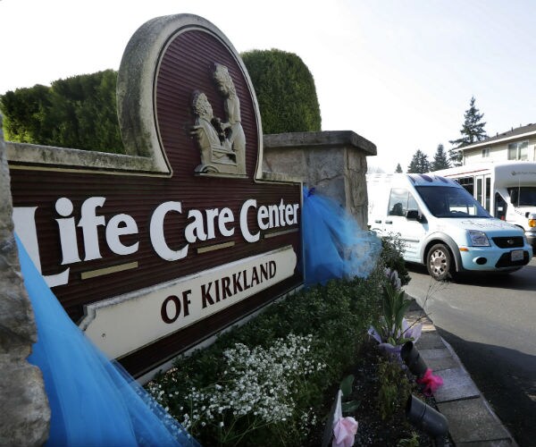 a vehicle leaves the life care center, where at least 30 coronavirus deaths 