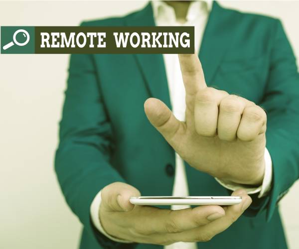 a man touching a screen labeled remote work