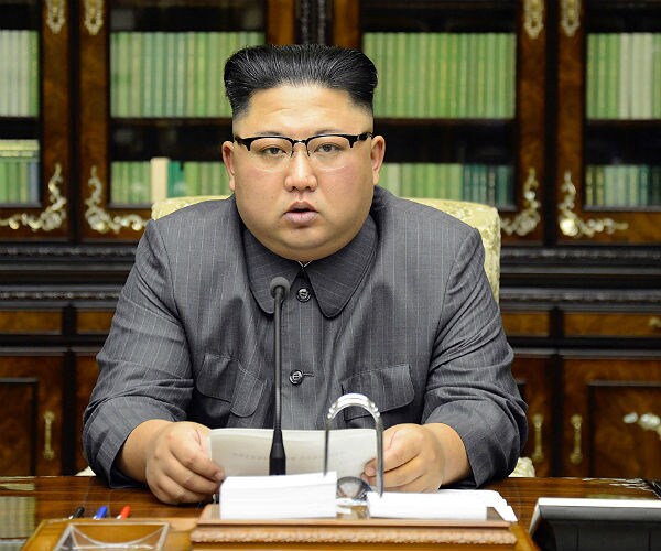 Video Shows Kim Jong Un Pushing Photographer Out of Wife's Way