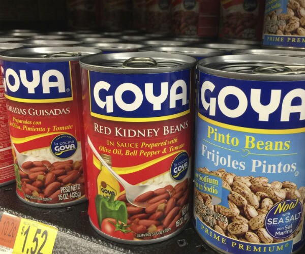 goya canned goods are shown for sale on a shelf at walmart