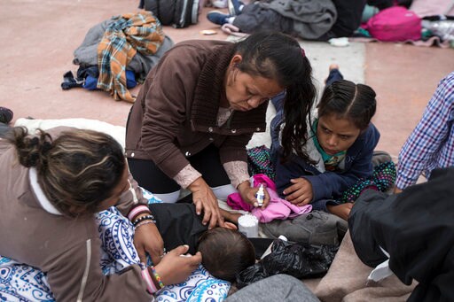 The Latest: Migrants in Caravan Start Seeking US Asylum