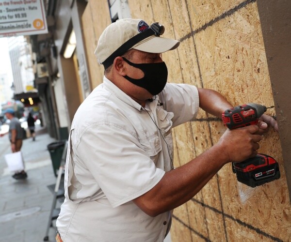 man boards up business as hurricane approaches coast