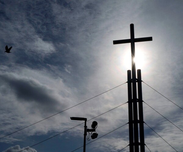cross is shown above an evangelical church in france