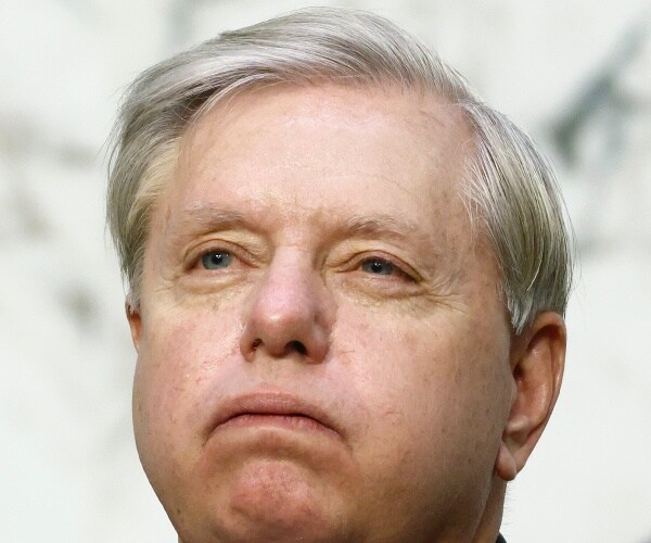 Senate Judiciary Committee Chairman Lindsey Graham listens to Supreme Court nominee Amy Coney Barrett