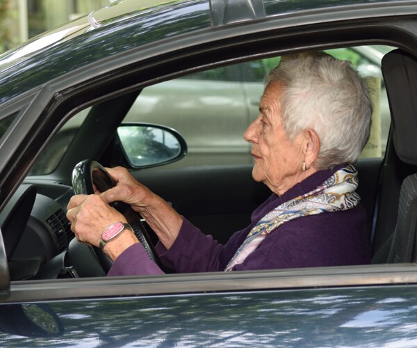 A senior citizen driving