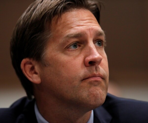 sasse in a suit close up