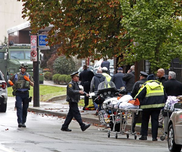 first responders surround the tree of life synagogue, rear center, in pittsburgh.