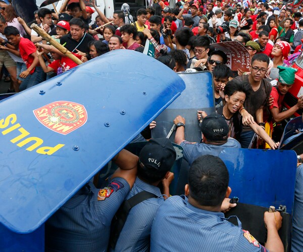 Philippines Protest Turns Violent as Police Van Rams Protesters